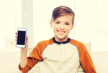 Wall Mural - smiling boy with smartphone at home