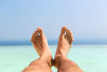 Male Feet On Beach