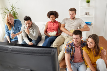 Poster - happy friends with popcorn watching tv at home