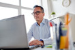 © Syda Productions - businessman in eyeglasses with laptop office
