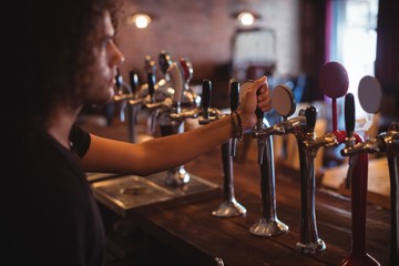 Wall Mural - Male bar tender at bar counter