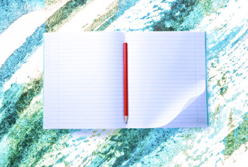 Wall Mural - Open blank notebook with red pencil