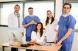© W PRODUCTION - portrait of a medical team with nurse doctor and surgeon in hospital office wearing medical and operating room outfit
