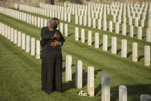 Black Couple Hugging In Military Cemetery