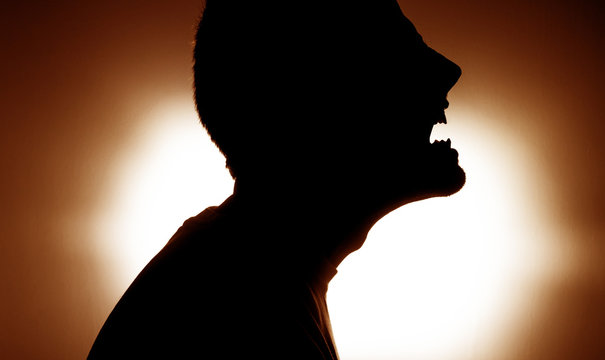 Fototapete - Screaming silhouette of a man in agony, concept of anger disheartened force