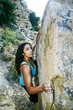© Peathegee Inc/Blend Images - Mixed Race woman rock climbing