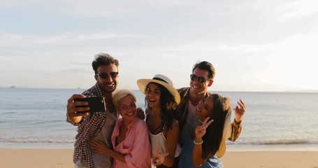 Wall Mural - peopel group take selfie photo on cell smart phone on beach, happy smiling man and woman friends sum
