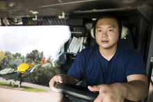 Chinese Fireman Wearing Headphones Driving Fire Truck