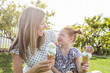 © Mike Kemp/Blend Images - Caucasian mother and daughter eating ice cream cones