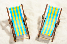 Two Sunbeds On The Beach: Top View