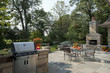 © BUILT Images/Blend Images - Outdoor seating furniture with stove and fireplace at patio of home.