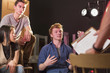 © Marc Romanelli/Blend Images - Student talking to teacher in theater class