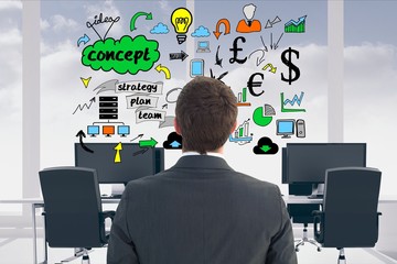 Poster - Rear view of businessman looking at icons in office