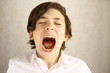 teenager boy yawning open mouth