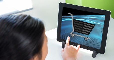 Poster - Cropped image of person touching shopping cart icon on tablet PC