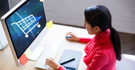 Poster - Businesswoman looking at shopping cart icon on computer