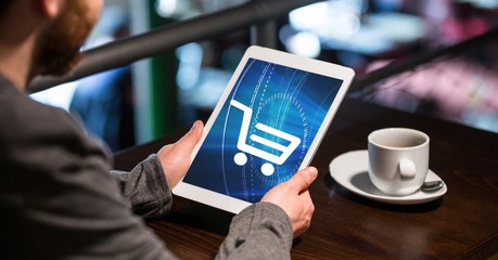 Poster - Businessman using tablet PC with shopping cart icon on screen