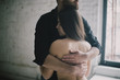 © Kateryna Soroka/Blend Images - Caucasian man hugging woman with bare back