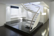 © BUILT Images/Blend Images - Modern white staircase with glass banister