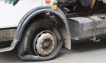Flat Tire Of An Old Fragment Of A Rusty Broken Truck