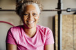 © Inti St Clair/Blend Images - Black woman smiling in garage