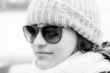 Fototapeta  - cool in shades and a winter cap