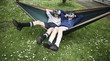 © Donald Iain Smith/Blend Images - Mixed Race brother and sister in hammock wearing virtual reality goggles