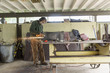 © Dennis Lane/Blend Images - Artist grinding steel in workshop