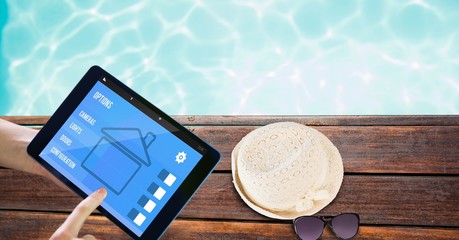 Poster - Hands using smart home application on tablet PC at poolside
