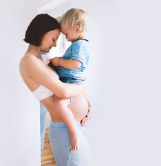 pregnant mother and son at home.
