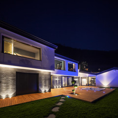 Exterior of luxurious modern villa in the night