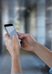 Poster - Hands with phone against blurry hallway