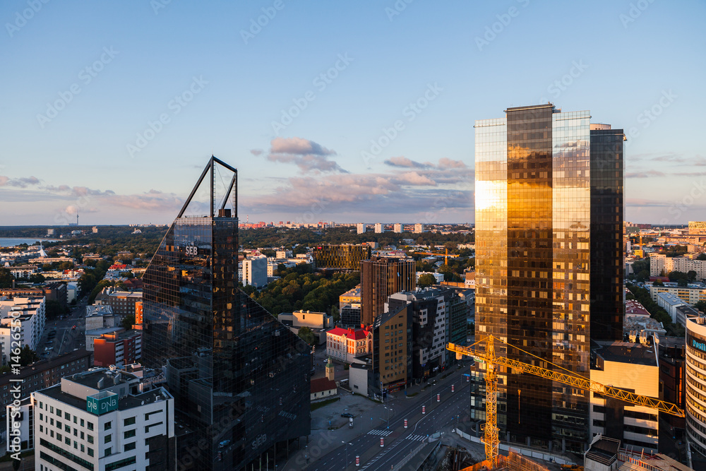 Obraz na płótnie TALLINN, ESTONIA - 22 JUL 2016: Amazing aerial shot of modern business district at sunset w salonie