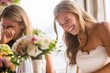© Adam Hester/Blend Images - Caucasian brides laughing at table