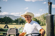 © Inti St Clair/Blend Images - Portrait of Caucasian farmer on tractor