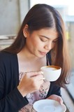 Fototapeta  - Beautiful woman drinking coffee 
