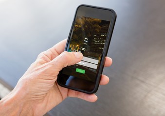 Hand with phone and login screen