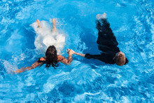 Wedding Couple In A Swimming Pool