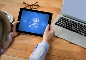 Poster - Person using Tablet with Shopping trolley icon