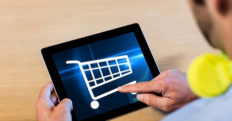 Poster - Cropped image of man touching shopping cart icons on tablet PC