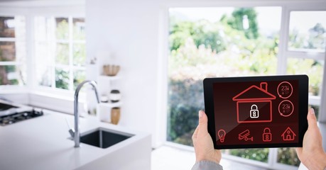 Poster - Hands using smart home app in kitchen