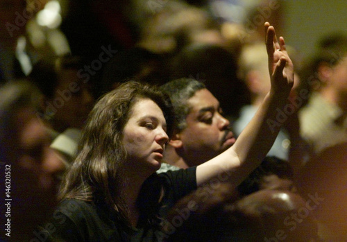 Woman Raises Hand In Praise At Isaiah Shoels Funeral Buy This