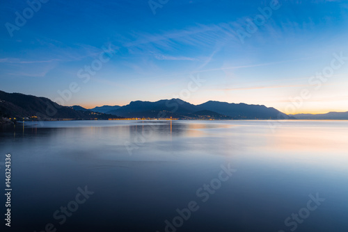 Fotografie, Obraz Lake Maggiore, Maccagno, Italy. Panorama towards Luino, at sunset