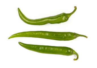 Green fresh jalapeno peppers close up on white