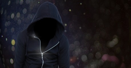 Wall Mural - Anonymous man wearing hood in front of lights