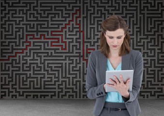 woman on tablet with maze background