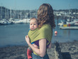 © LoloStock - Mother with baby in harbor