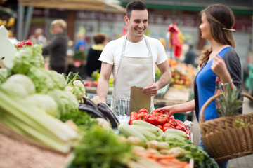 woman shopping vegetable at street market.