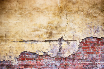 Wall Mural - brick wall with damaged plaster, background shattered cement surface