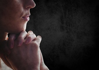 Poster - woman praying against black wall